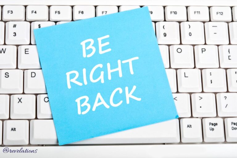 Be right back sign laying on keyboard for post about pause